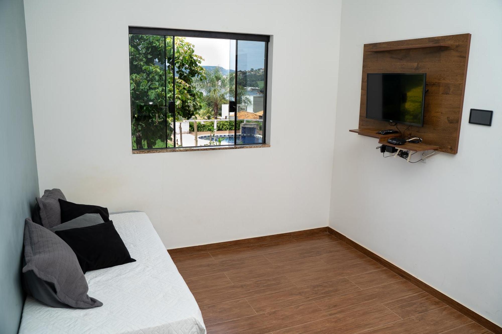 Casa Com Piscina Vista Para Lago, 03 Quartos Confortaveis กาปีตอลิโอ ภายนอก รูปภาพ