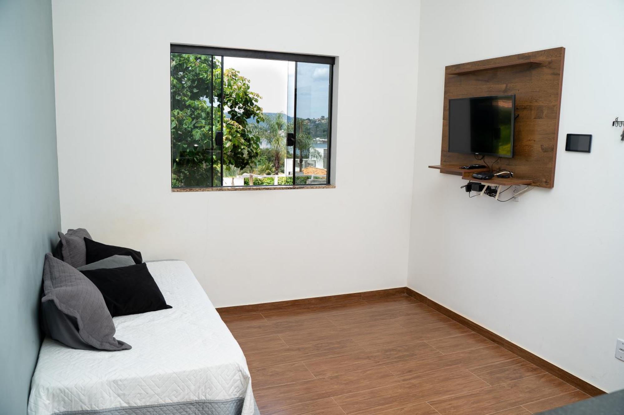 Casa Com Piscina Vista Para Lago, 03 Quartos Confortaveis กาปีตอลิโอ ภายนอก รูปภาพ